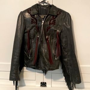 Woman’s leather jacket size 10 with tassels and rose details